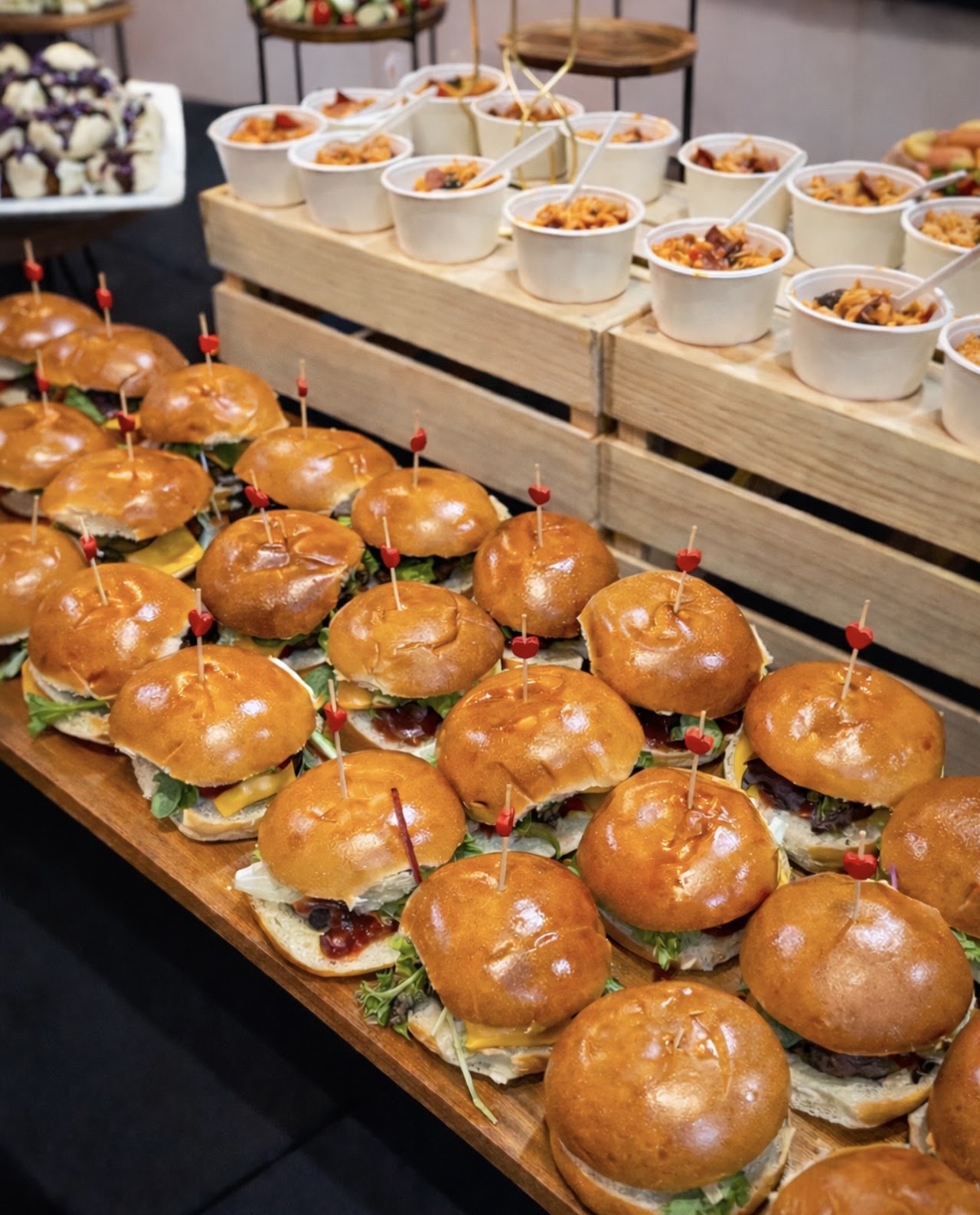 Rows of gourmet sliders plated for an Adelaide event